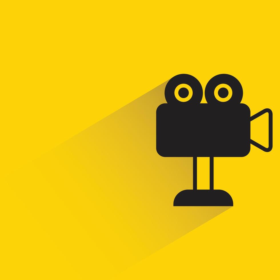 video camera on stand icon yellow background vector