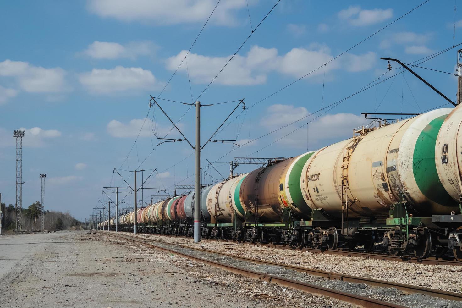Freight trains with old grubby tanks at the station. photo