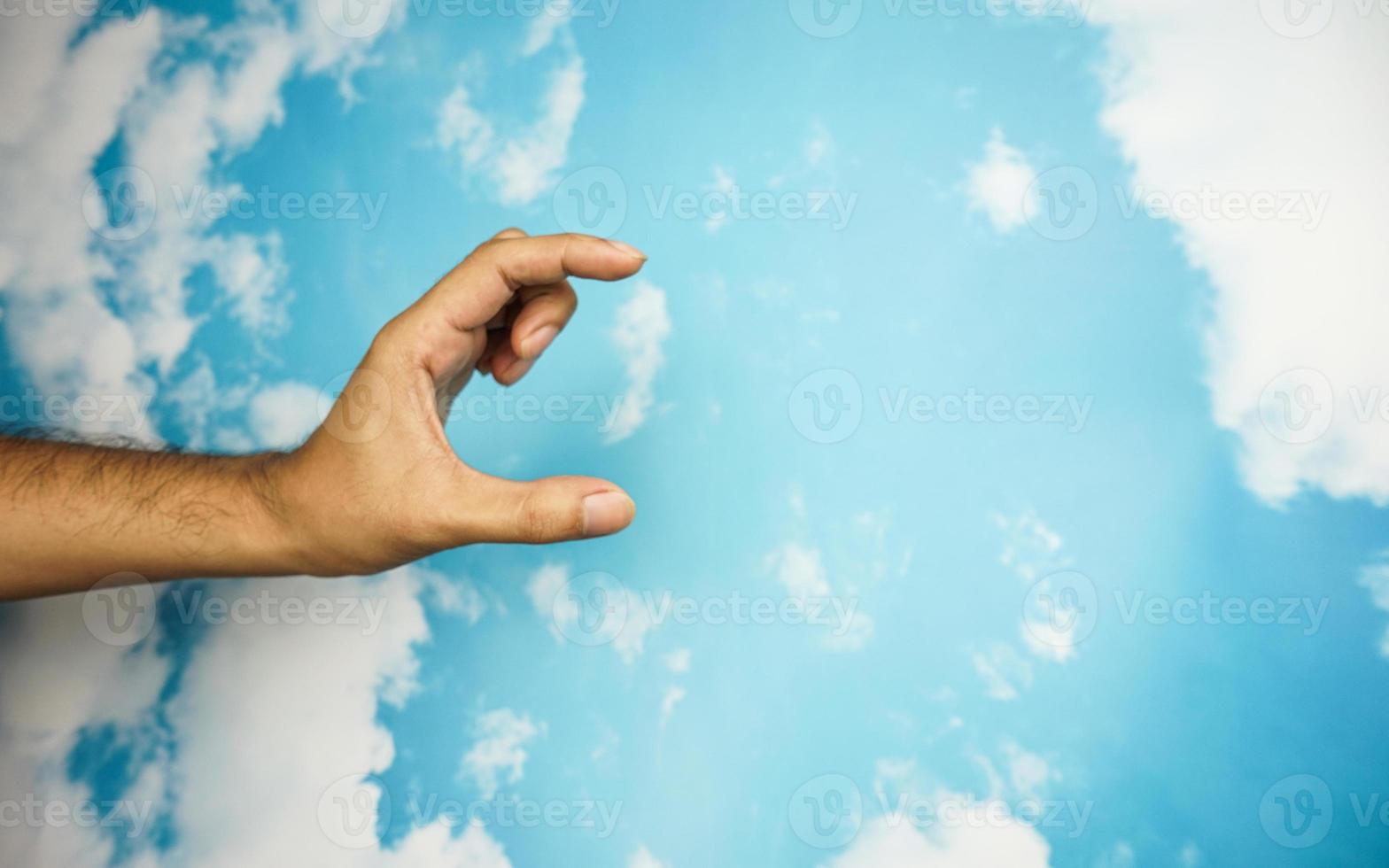 hand symbol isolated from sky background. concept of sign language photo