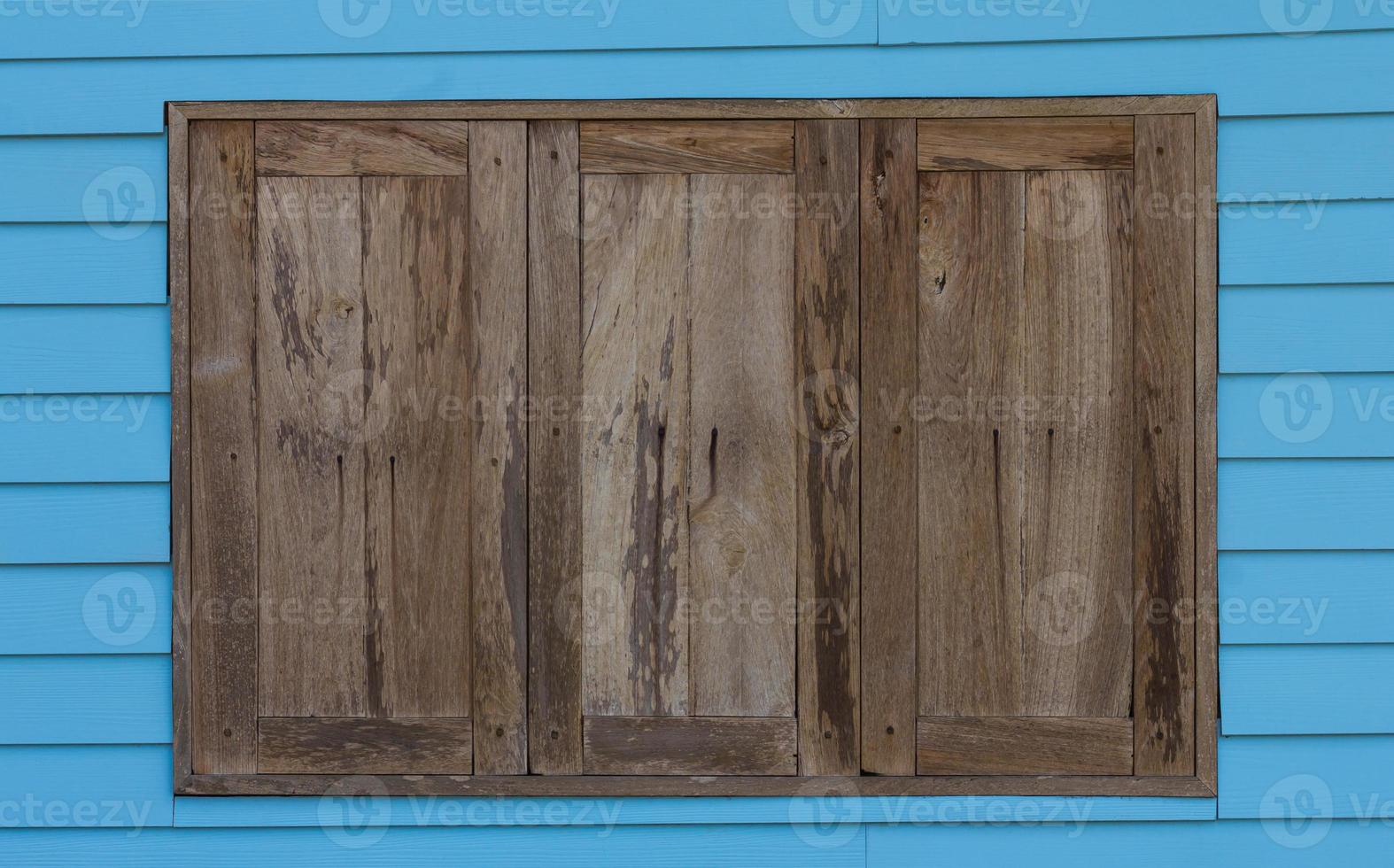 Old wood window blue wall photo