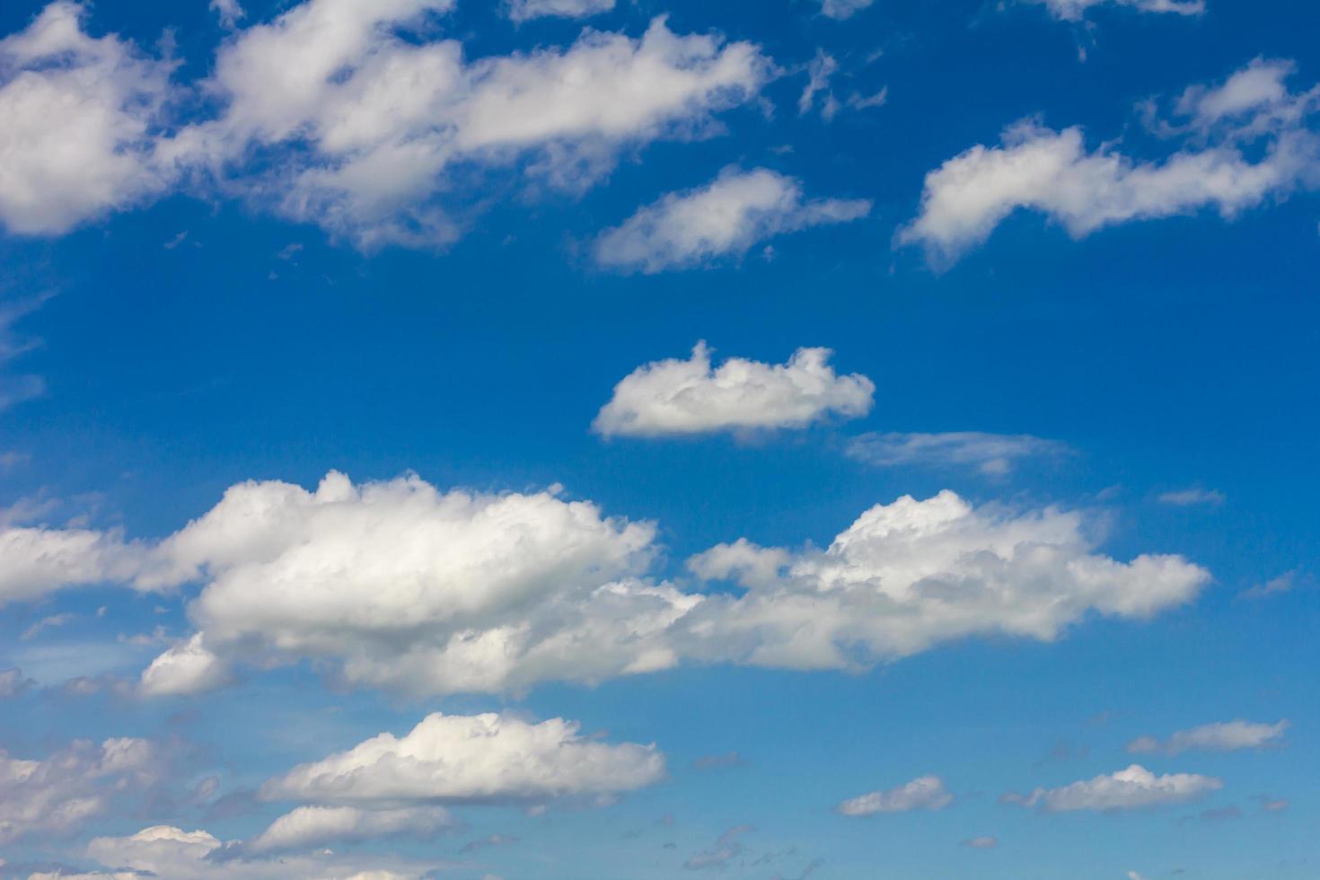 Fluffy clouds floating sky photo