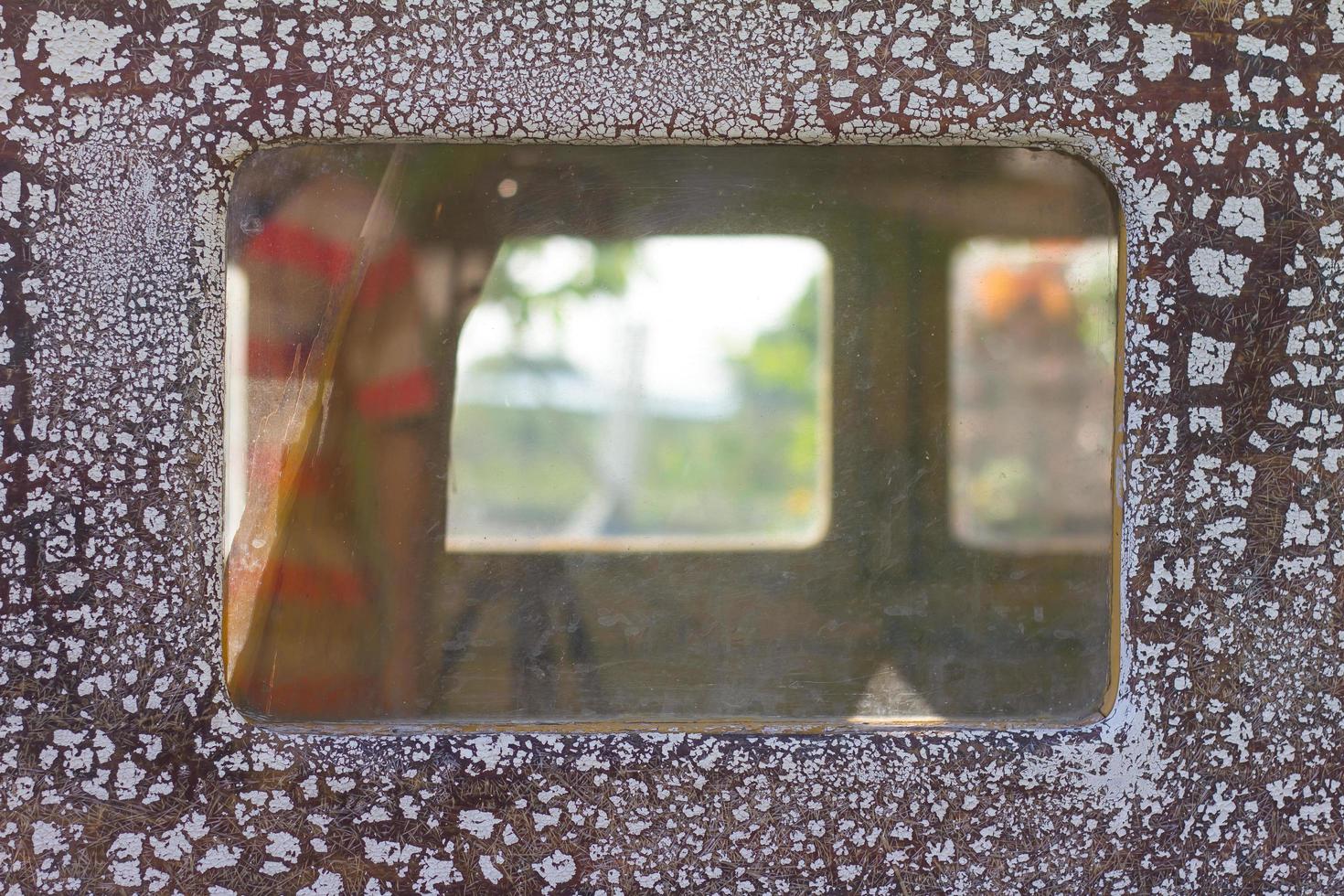 Peephole squares of boat photo