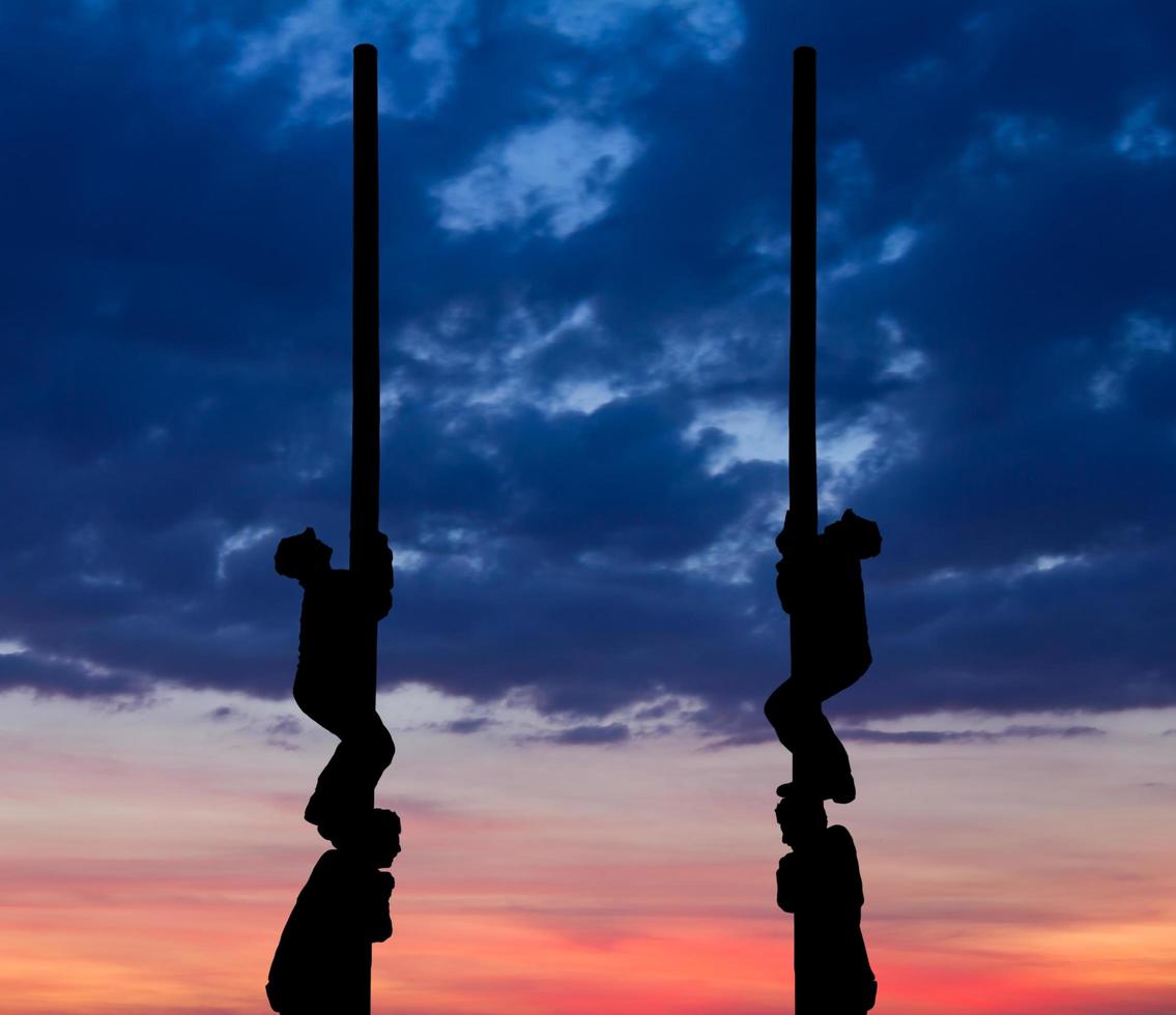 Silhouette pole climbing photo