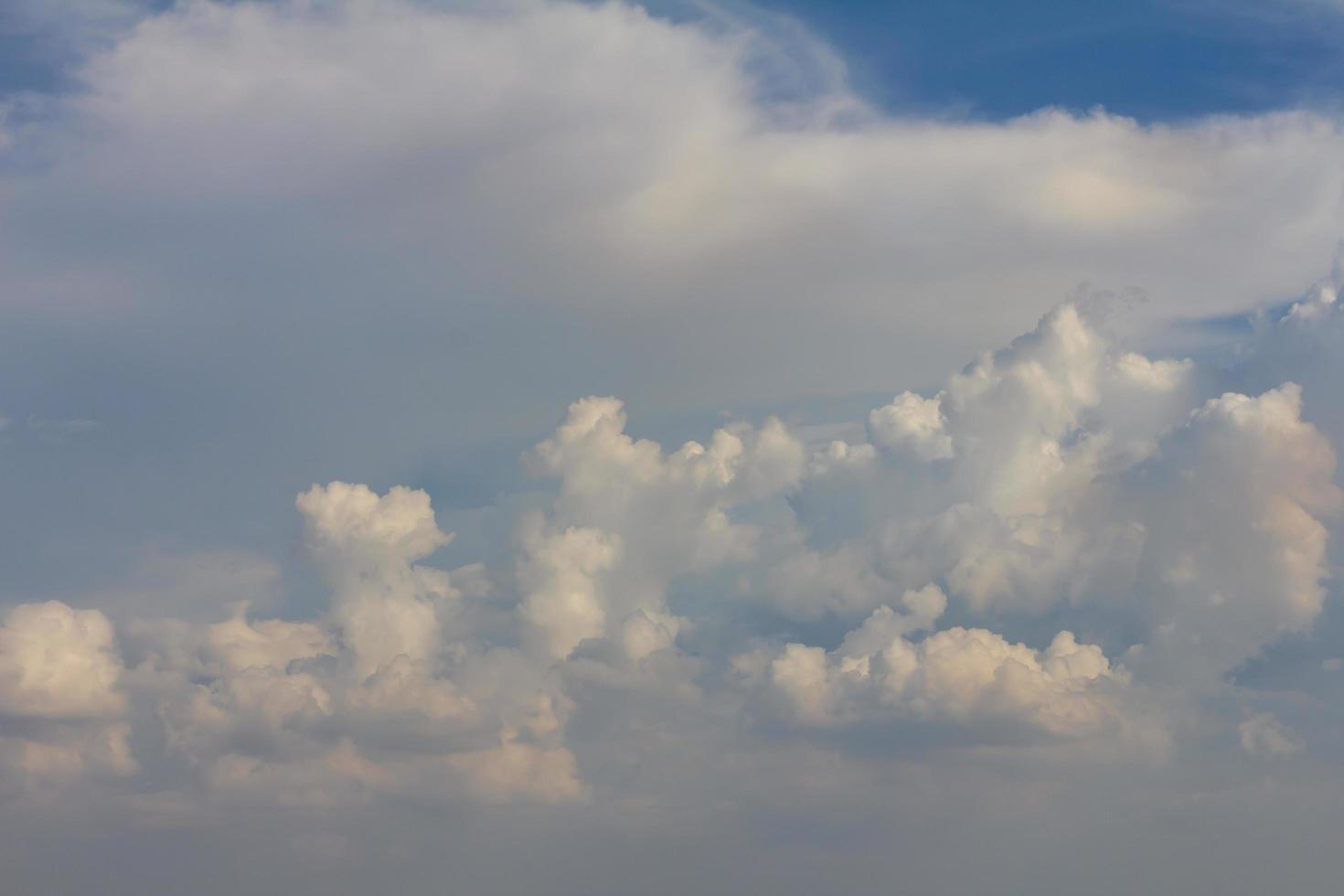 Fluffy white clouds gather photo