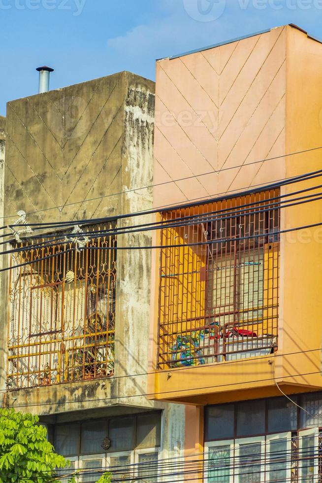 Colorful shabby old and dirty apartments Don Mueang Bangkok Thailand. photo