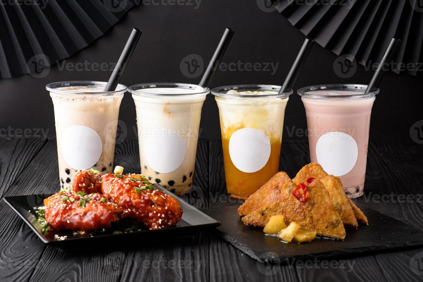 Milk bubble tea with tapioca and fried chicken with sweet potatoes. photo