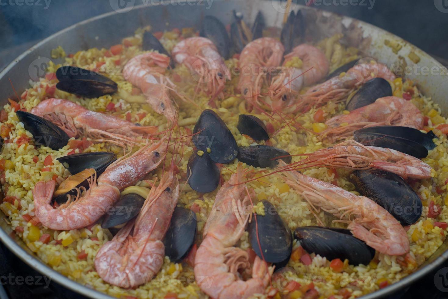 Spanish paella prepared in the street restaurant photo