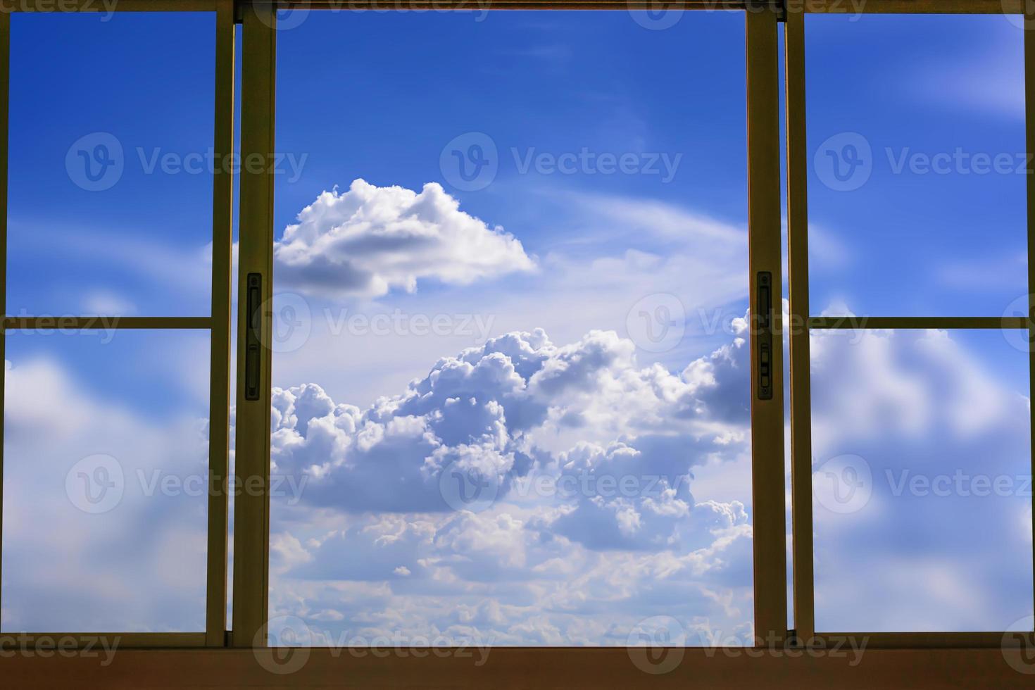 Look at blue cloudy sky in window photo
