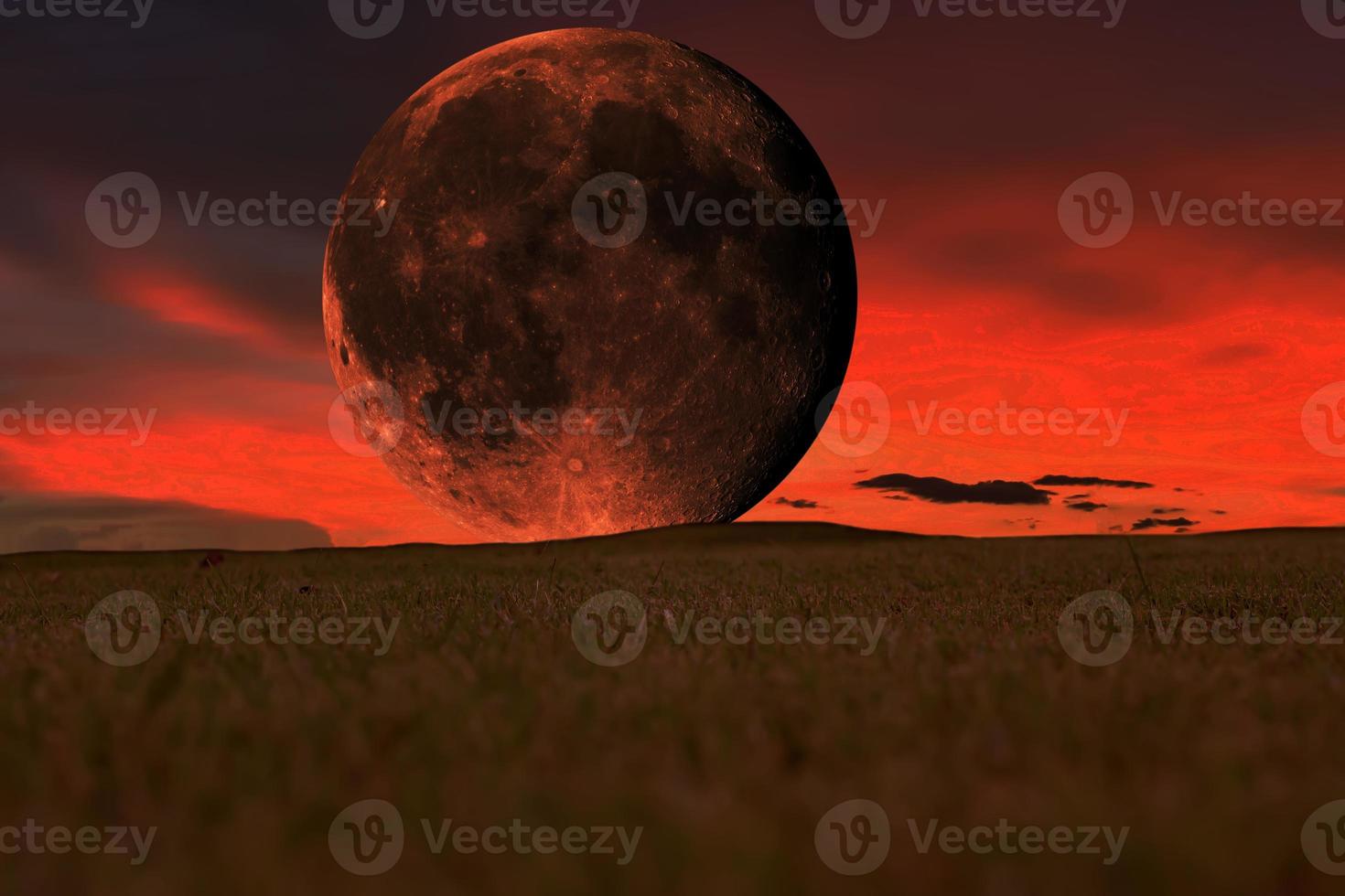 Super blood moon setting in the sky. Elements of the furnished by NASA. photo