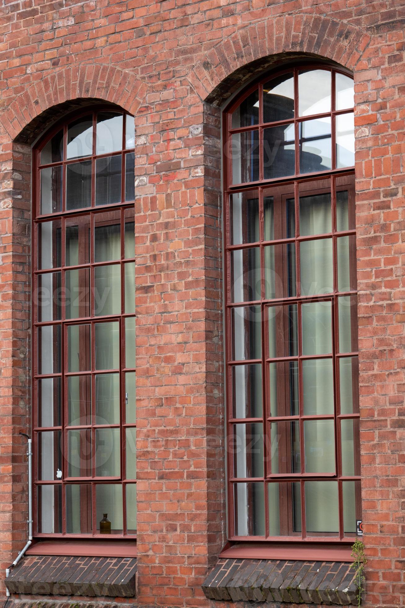Part of an old industrial building, windows 7422890 Stock Photo at Vecteezy