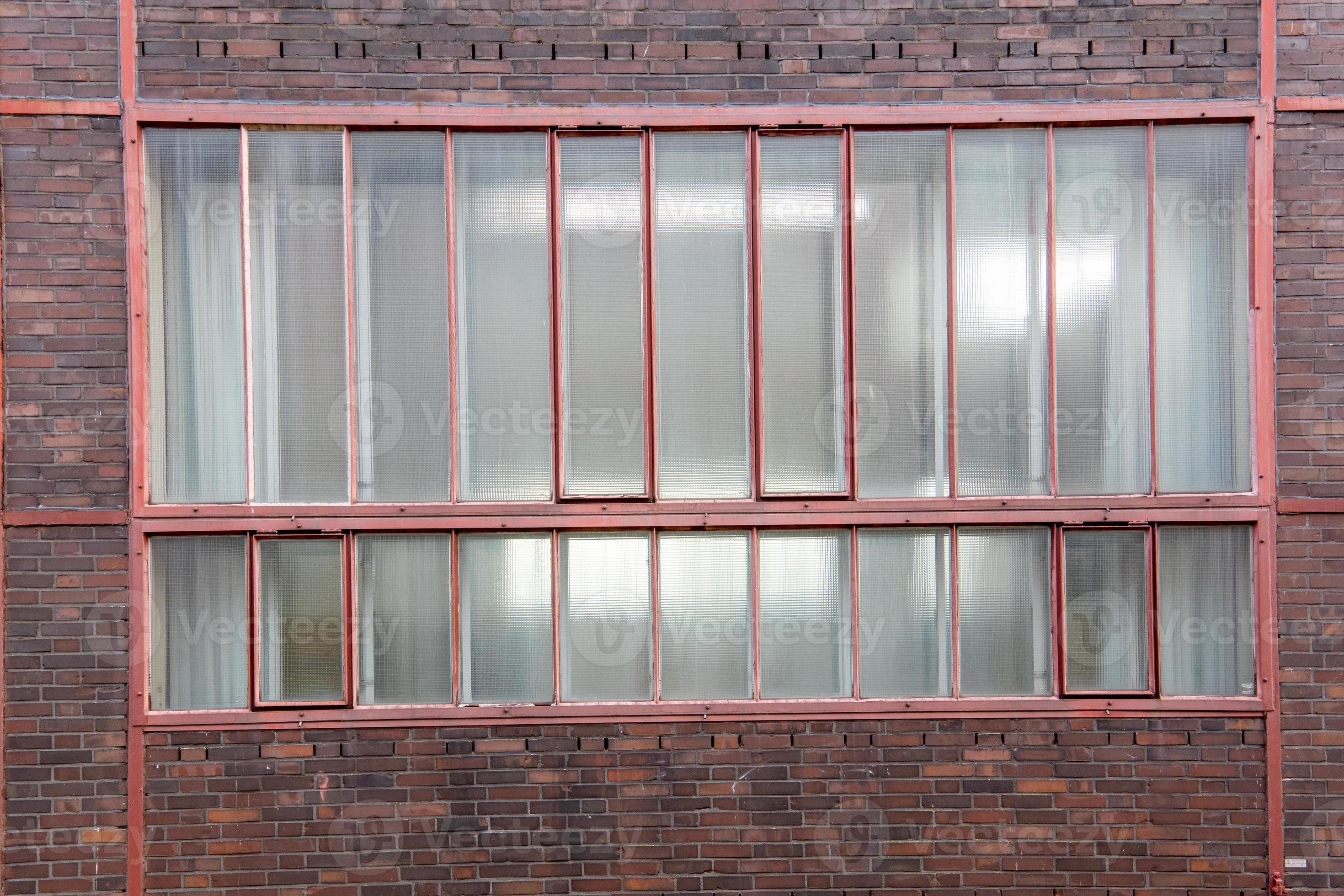 Part of an old industrial building, windows 7422894 Stock Photo at Vecteezy