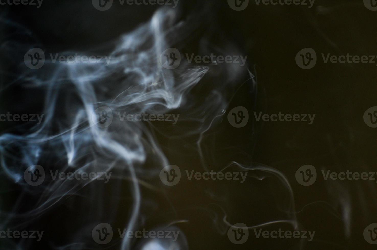 abstract background of smoke or fog on black background photo