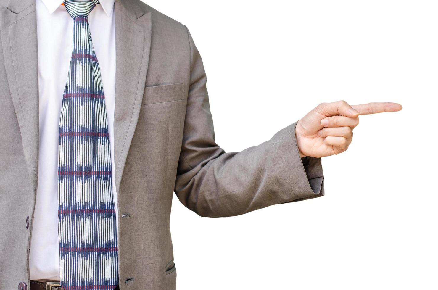 Young business man pointing to his side on white background photo