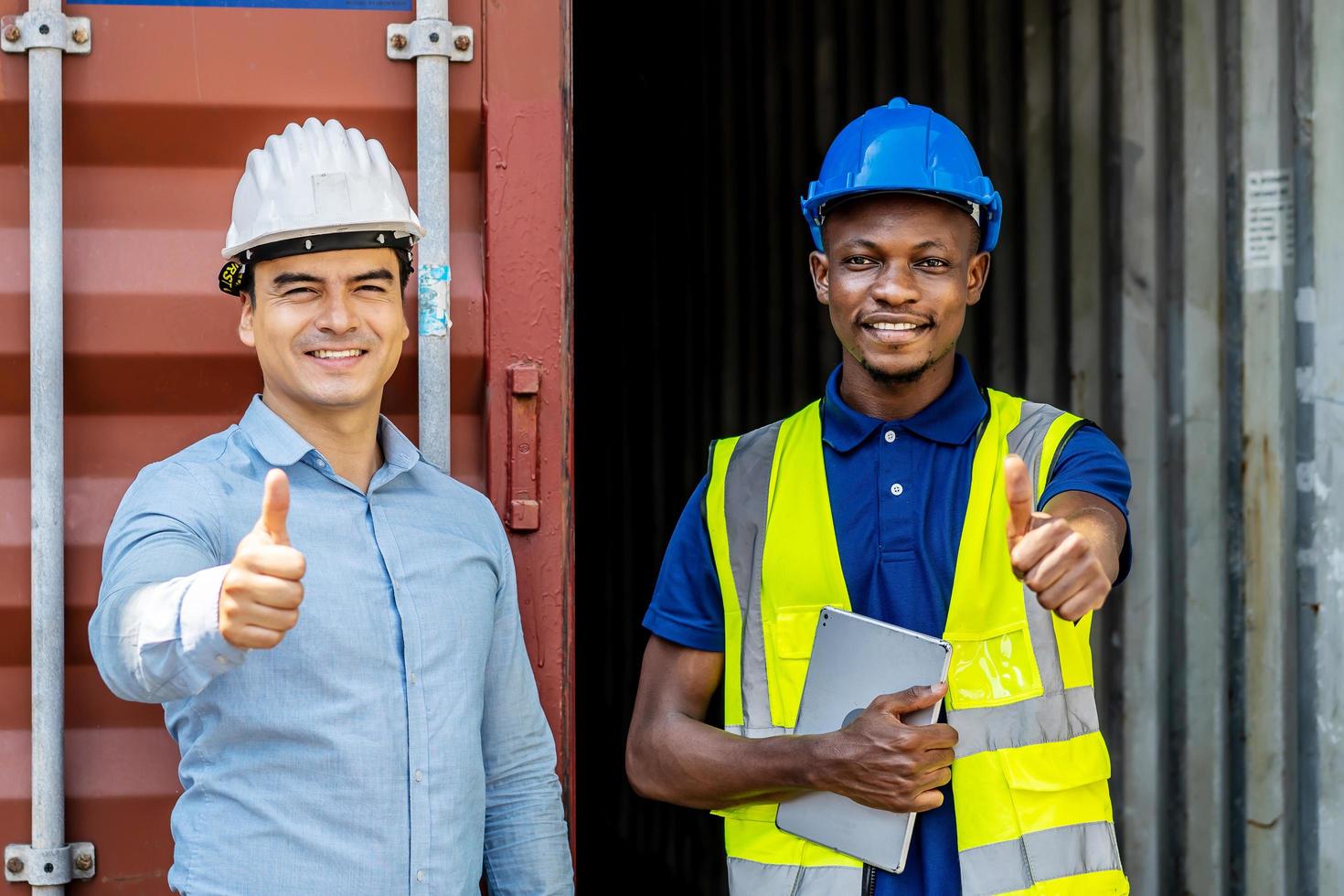 Workers and manager thumbs up after successful delivery of goods onto the ship, Where they are located in a harbor area with a lot of containers photo