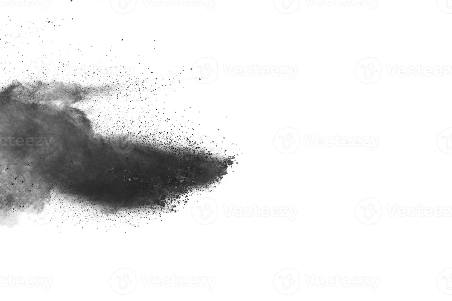 Black powder explosion against white background. photo