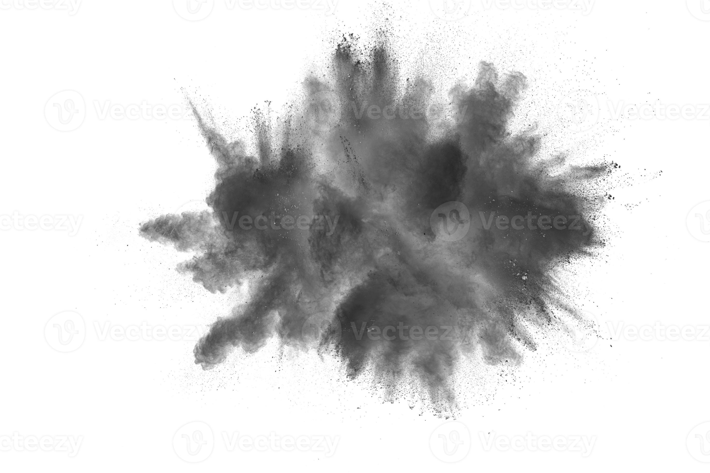 Black powder explosion. The particles of charcoal splatter on white background. Closeup of black