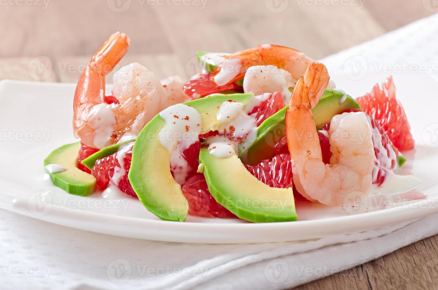 California salad - a mix of avocado, grapefruit and shrimp, seasoned with cayenne pepper yogurt photo
