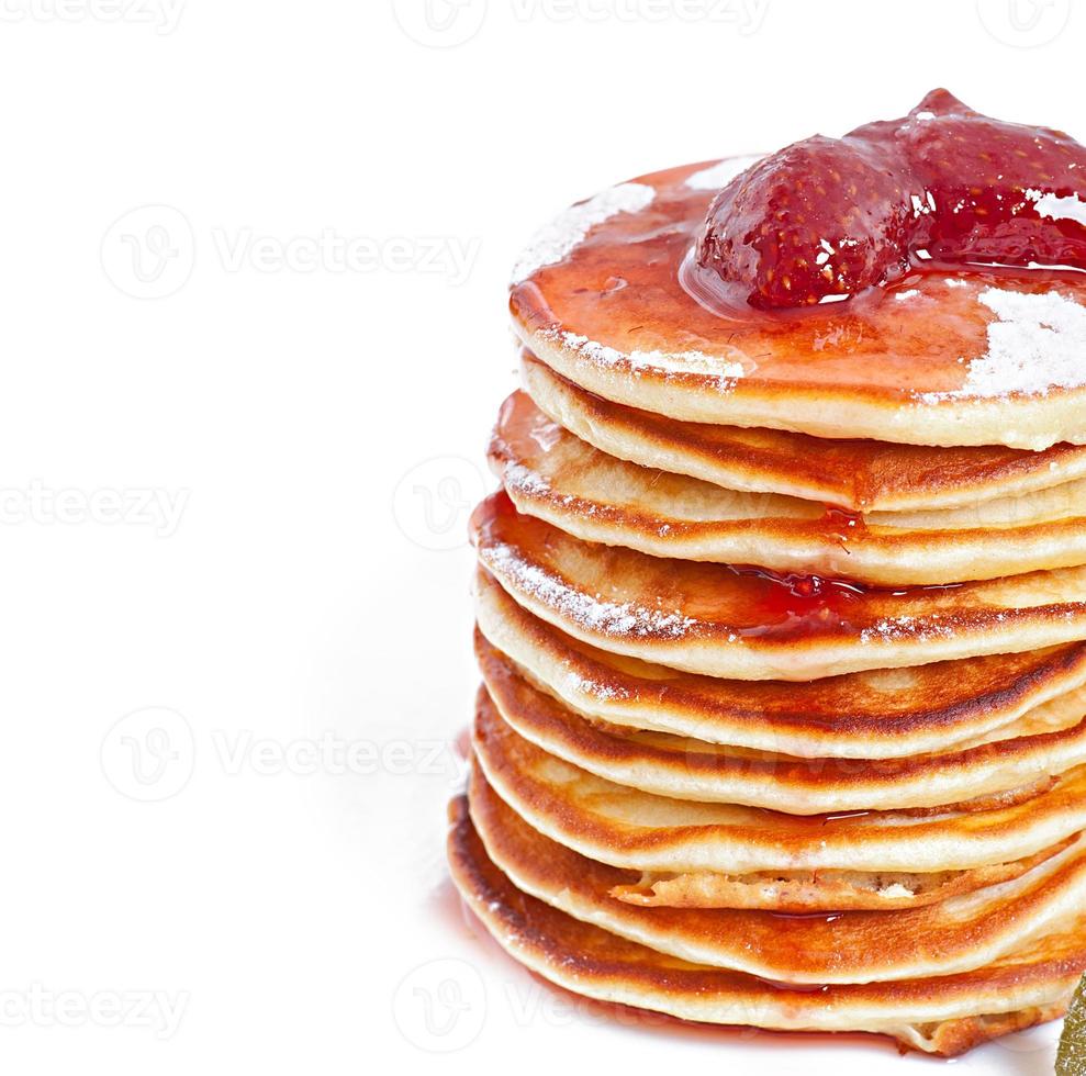 Delicious pancakes with strawberry jam photo