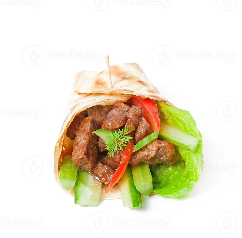Tortilla wraps with meat and fresh vegetables photo