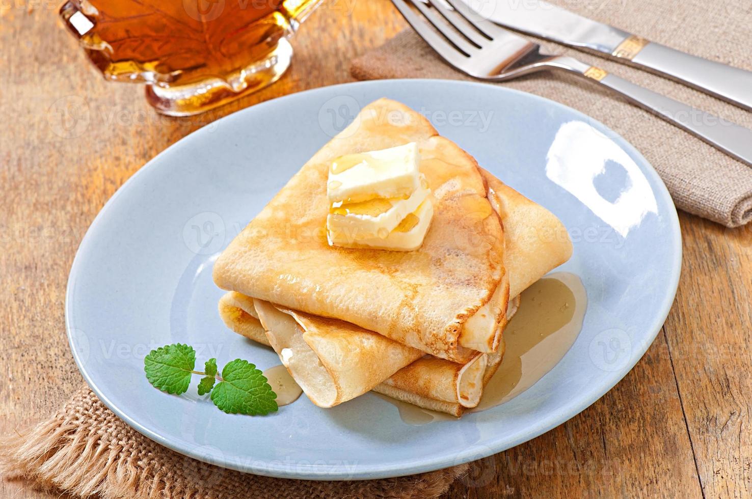 Pancakes with maple syrup photo