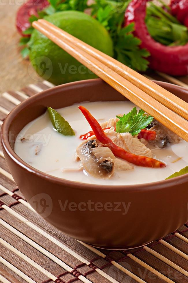 Thai soup with chicken and mushrooms photo