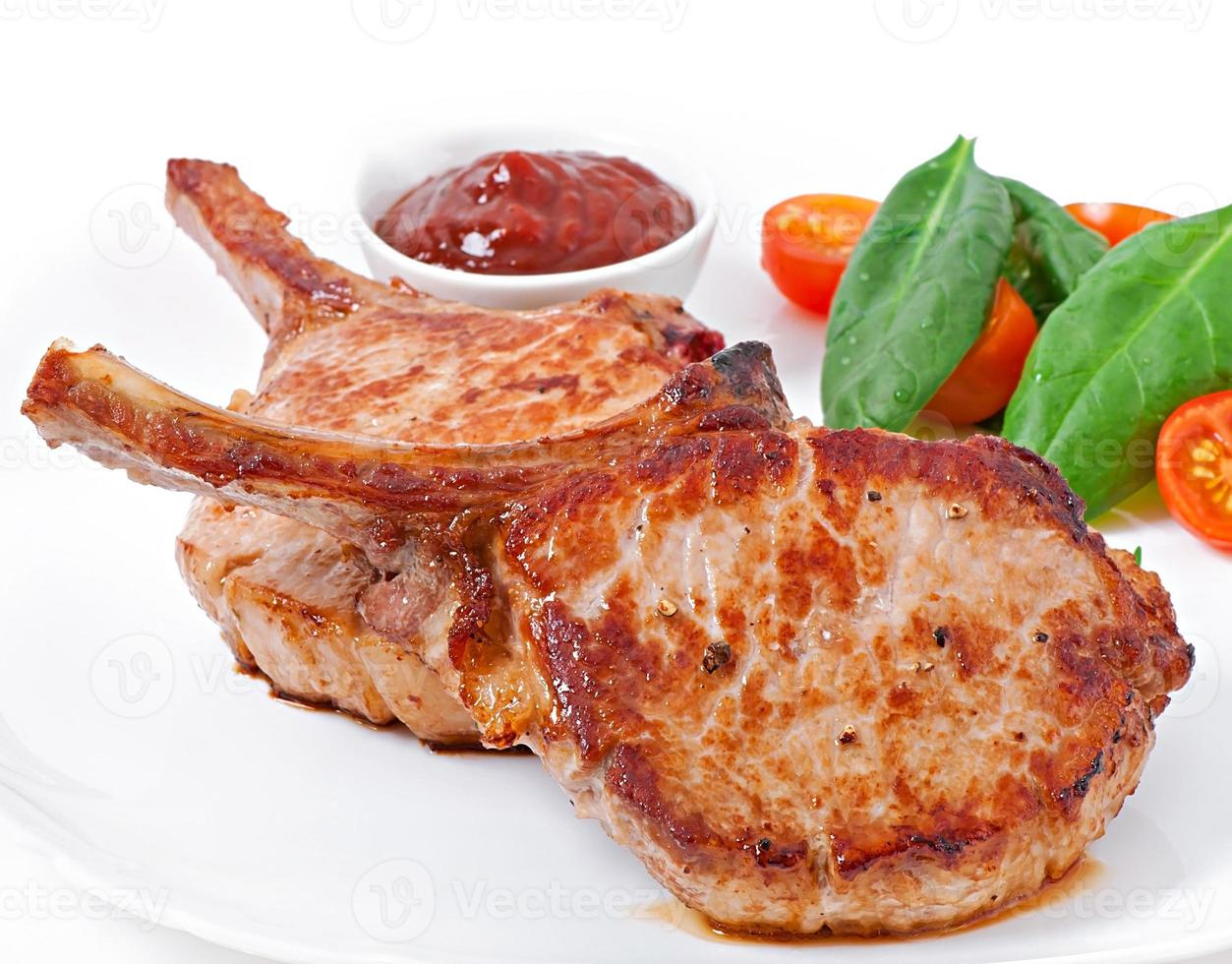 Juicy grilled pork fillet steak with  green beans photo