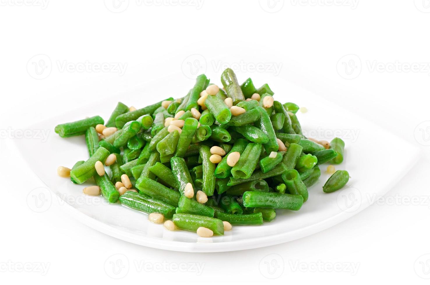 Fried green beans with cedar nuts photo