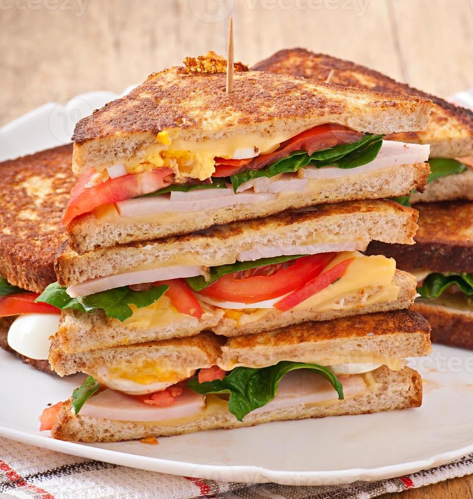 Club sandwich with chicken and ham photo