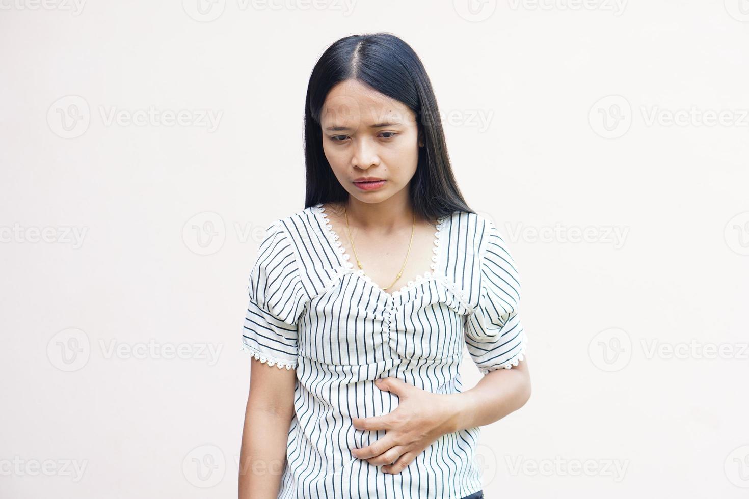 Woman suffer from stomachacheChronic gastritis Abdomen bloating concept photo