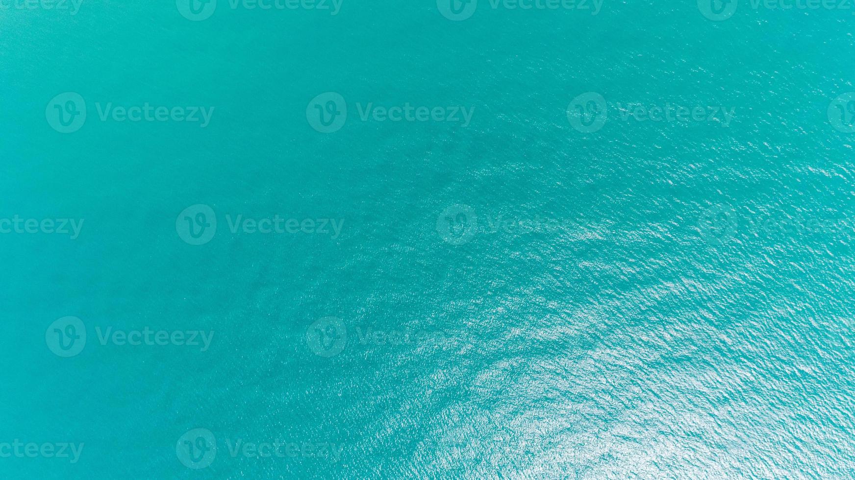 Ocean water texture. Aerial view of sea surface. Top view of transparent  turquoise ocean water surface. 7426164 Stock Photo at Vecteezy