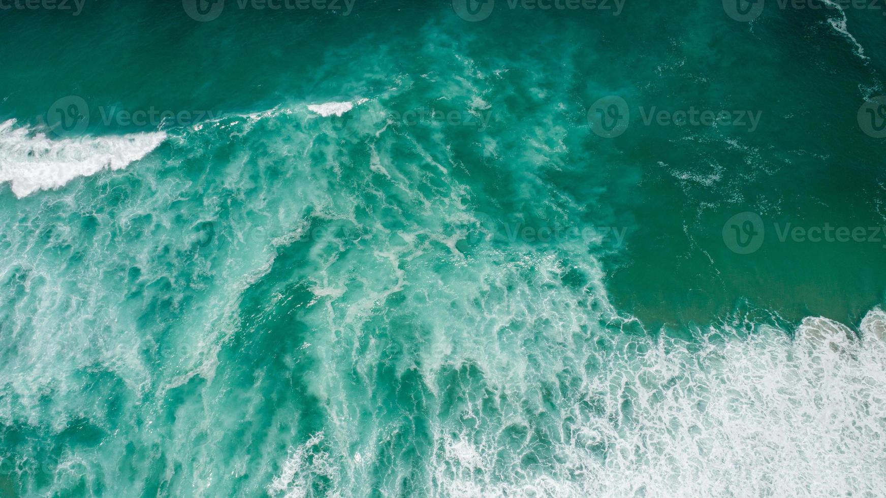 Top View texture Waves, Foaming and Splashing in the Ocean, Sunny Day photo
