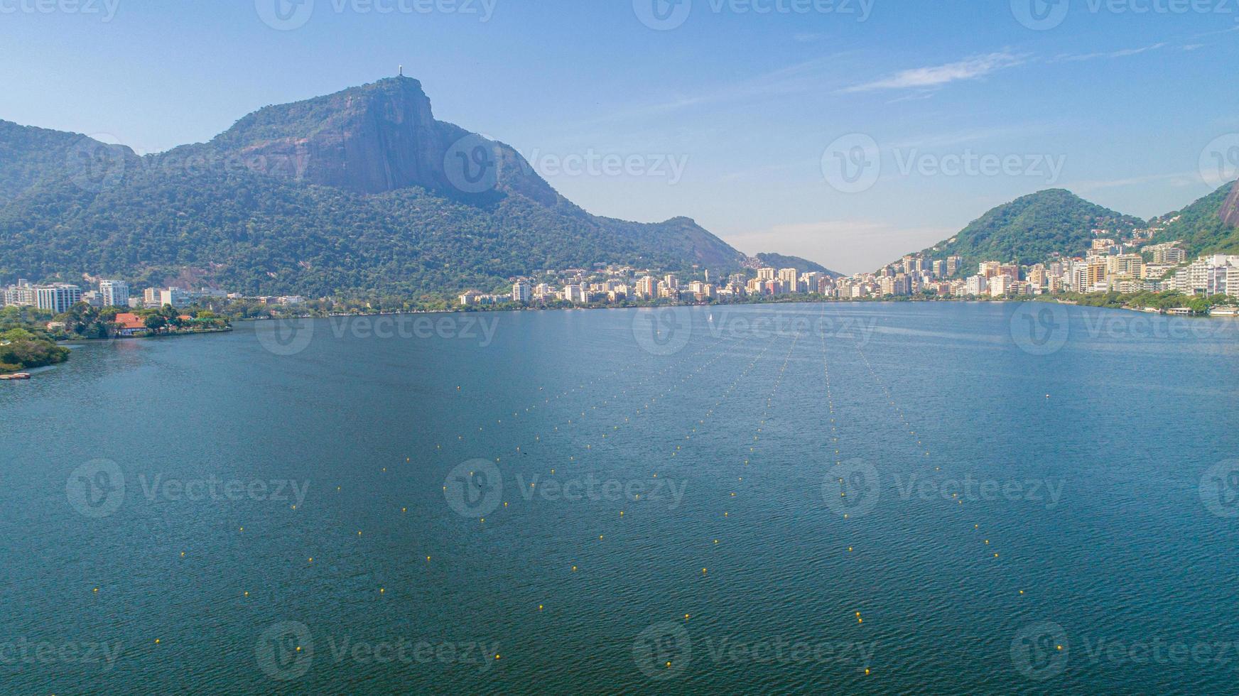 Aerial view of seawater lake Rodrigo de Freitas Lagoon in city of Rio de Janeiro. You can see the statue of Christ the Redeemer in the background. photo