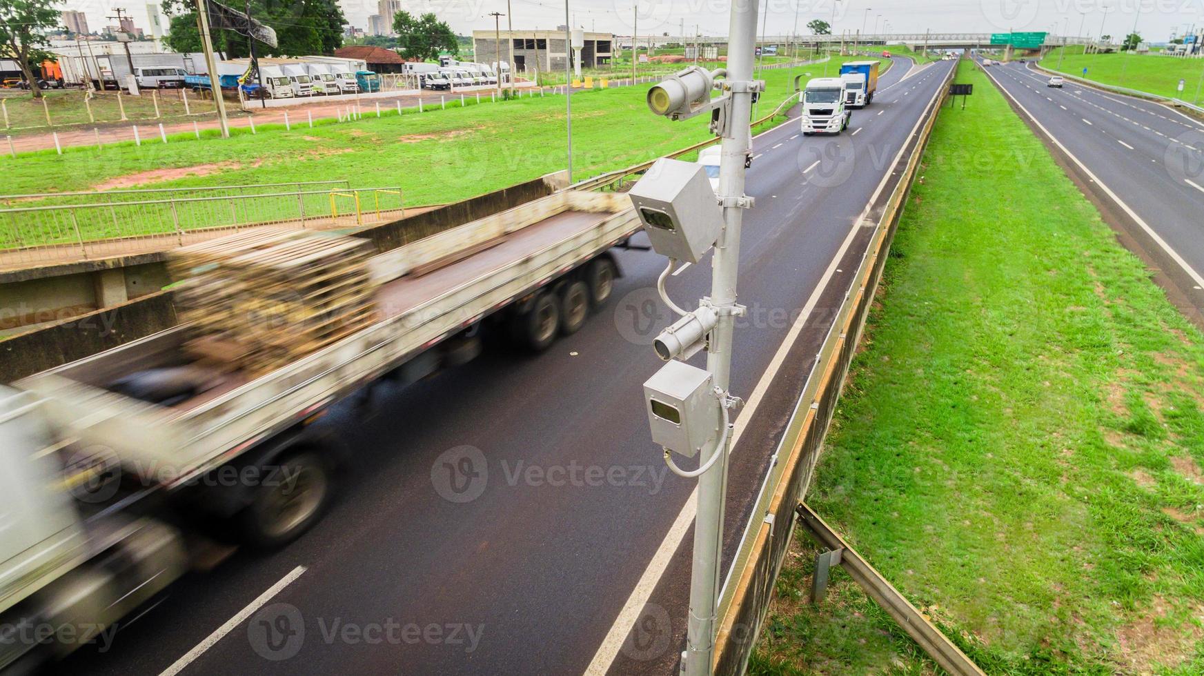 Traffic radar with speed enforcement camera in a highway. photo