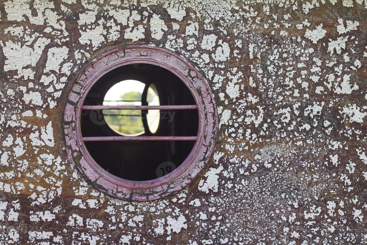 Peephole of wooden boats photo