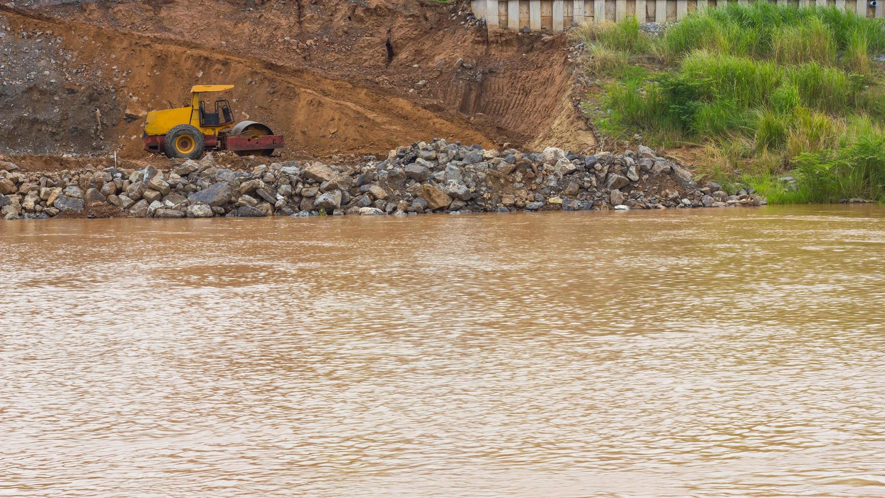 Steamroller with landslide. photo