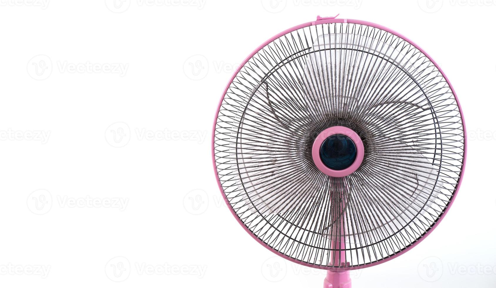 dirty electric fan on white background photo