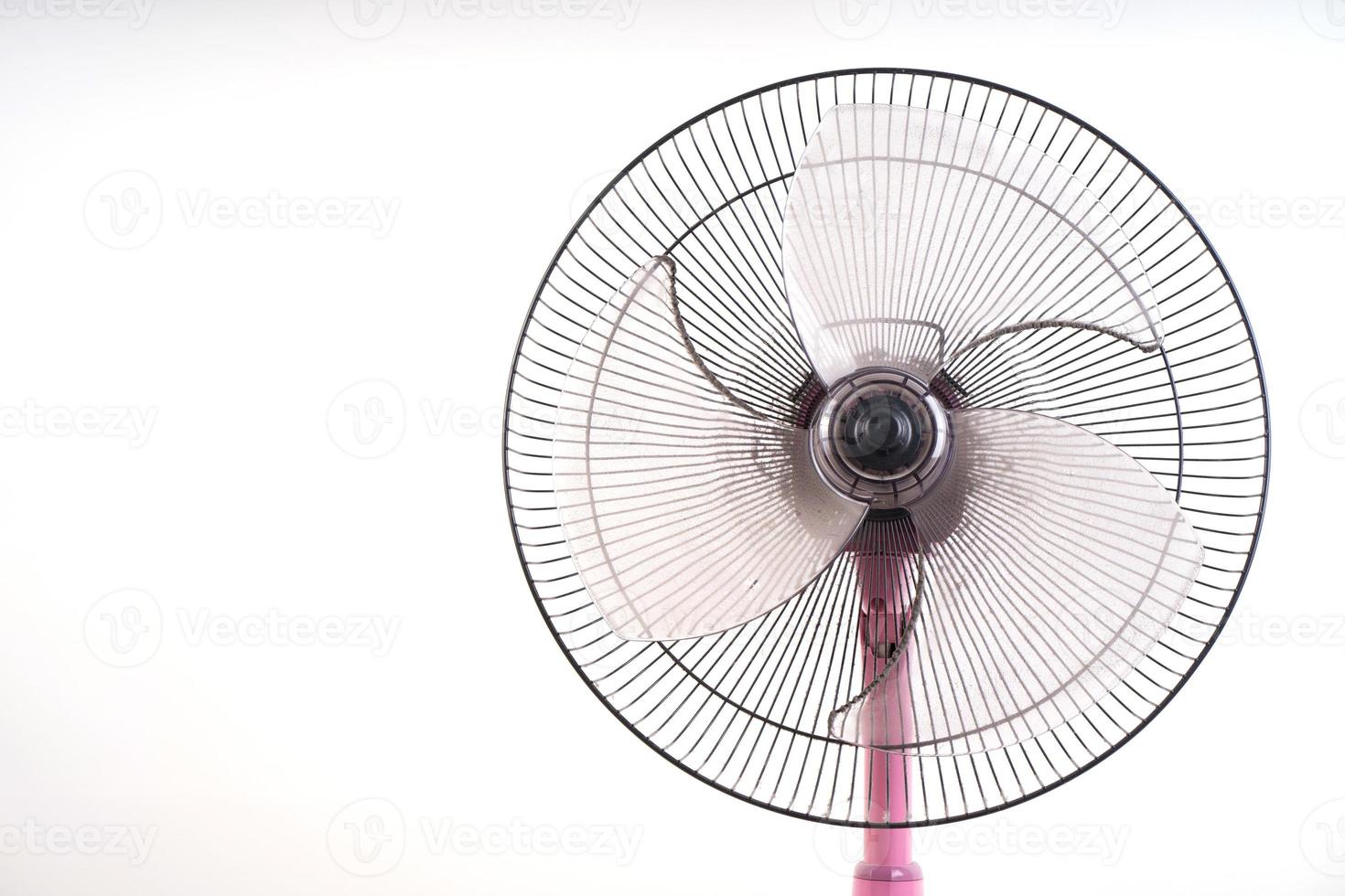 dirty electric fan on white background photo