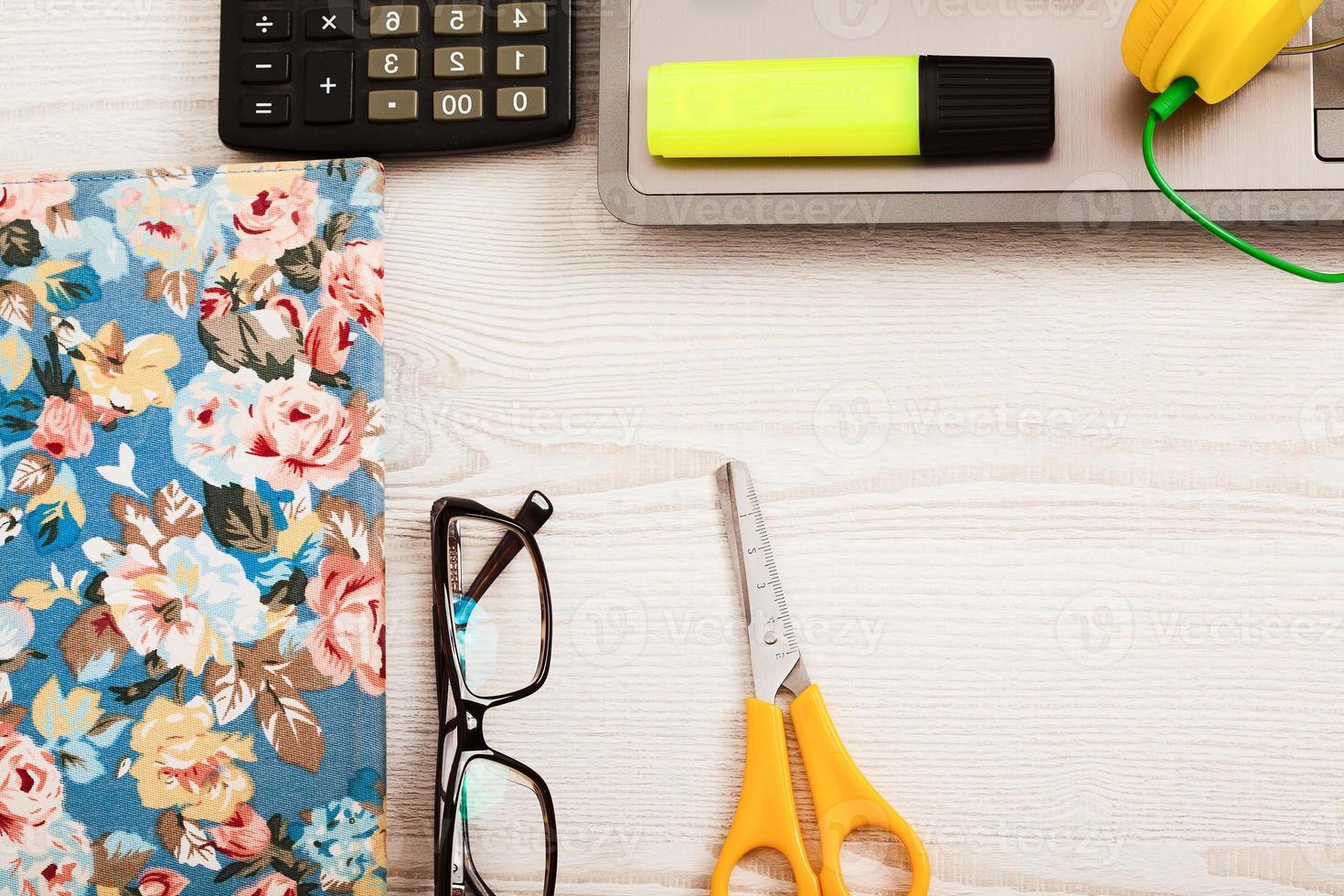 Creative workspace with work accessories and copy space on wooden table. Top view photo