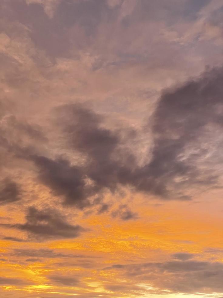 very beautiful twilight sky, a blend of orange and blue colors. beautiful view of the evening sky. clouds, sky and rainbow that adorn the atmosphere in the afternoon. Evening view in Jakarta. blur photo