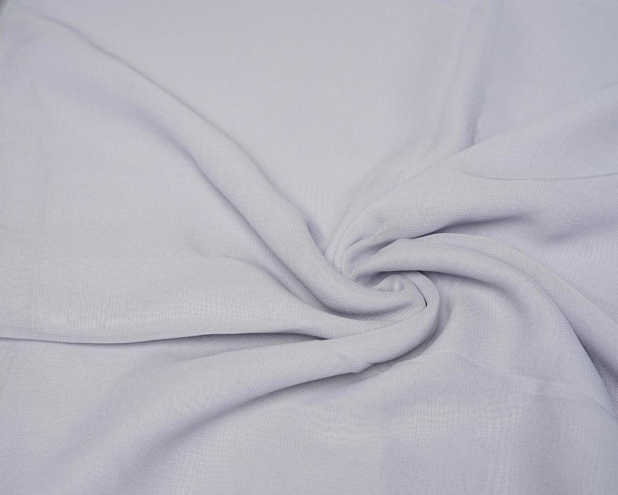 The texture of the hijab fabric when shaped like waves. Looks beautiful looks like a flower painting. Fashion needs in the month of Ramadan before Eid. focus blur. women's hijab. women's cloth mock-up photo
