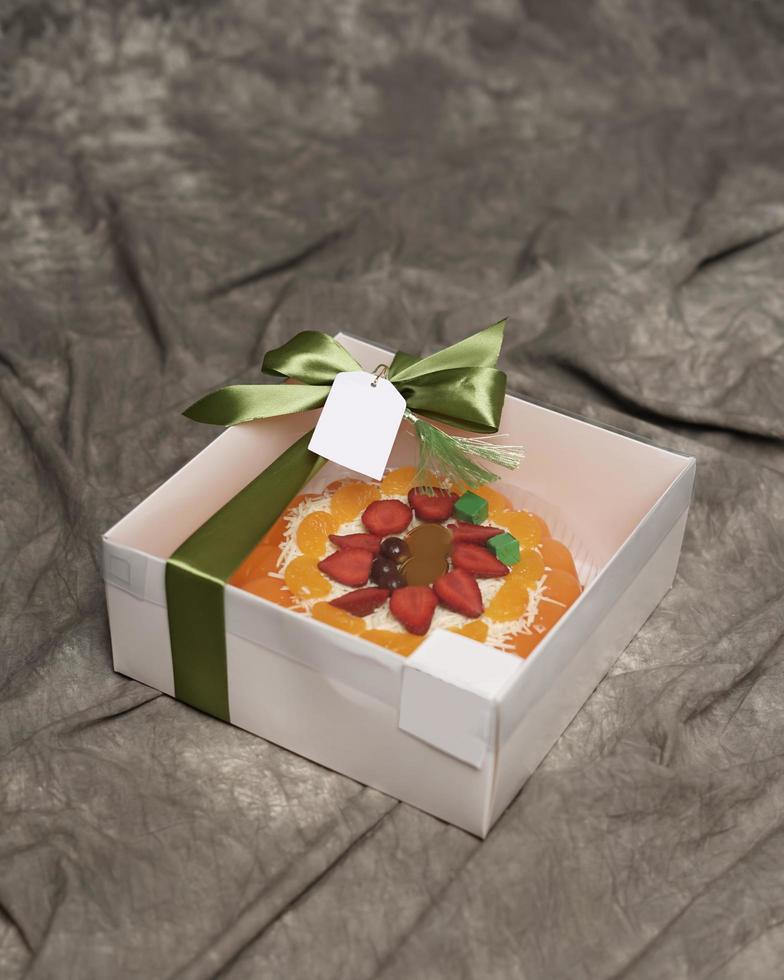 Lebaran parcels or Hampers, usually distributed at the moment of Eid. The packaging box contains a beautiful and attractive jelly cake. Also suitable for birthday cakes. Eid greetings. Focus Blur. photo