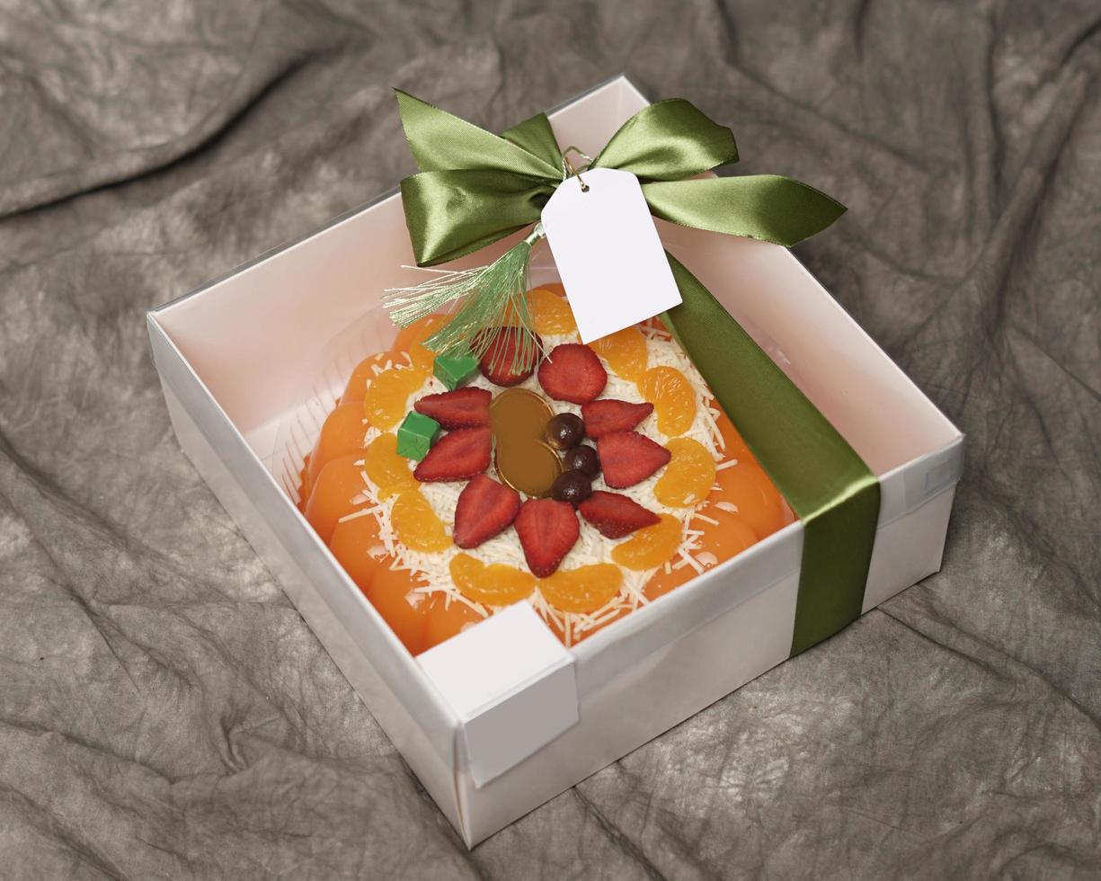 Lebaran parcels or Hampers, usually distributed at the moment of Eid. The packaging box contains a beautiful and attractive jelly cake. Also suitable for birthday cakes. Eid greetings. Focus Blur. photo