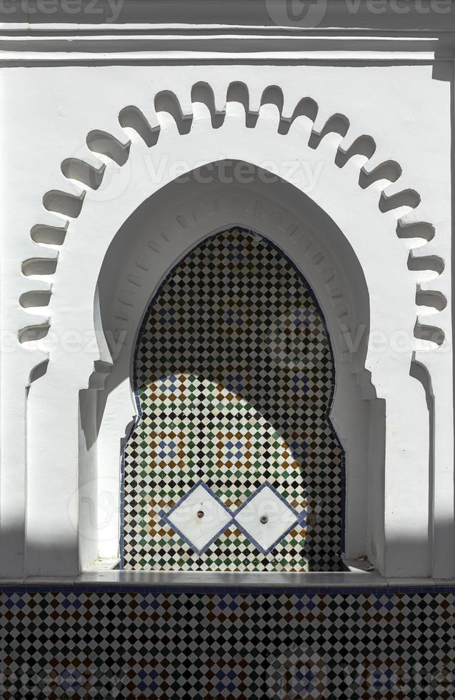 Arabic architecture in the old medina. Streets, doors, windows, details photo