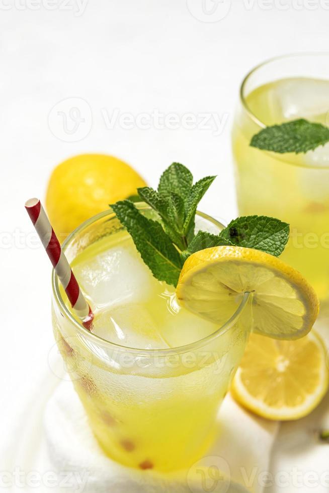 Fresh Lemonade or mojito cocktail with lemon, mint and ice photo