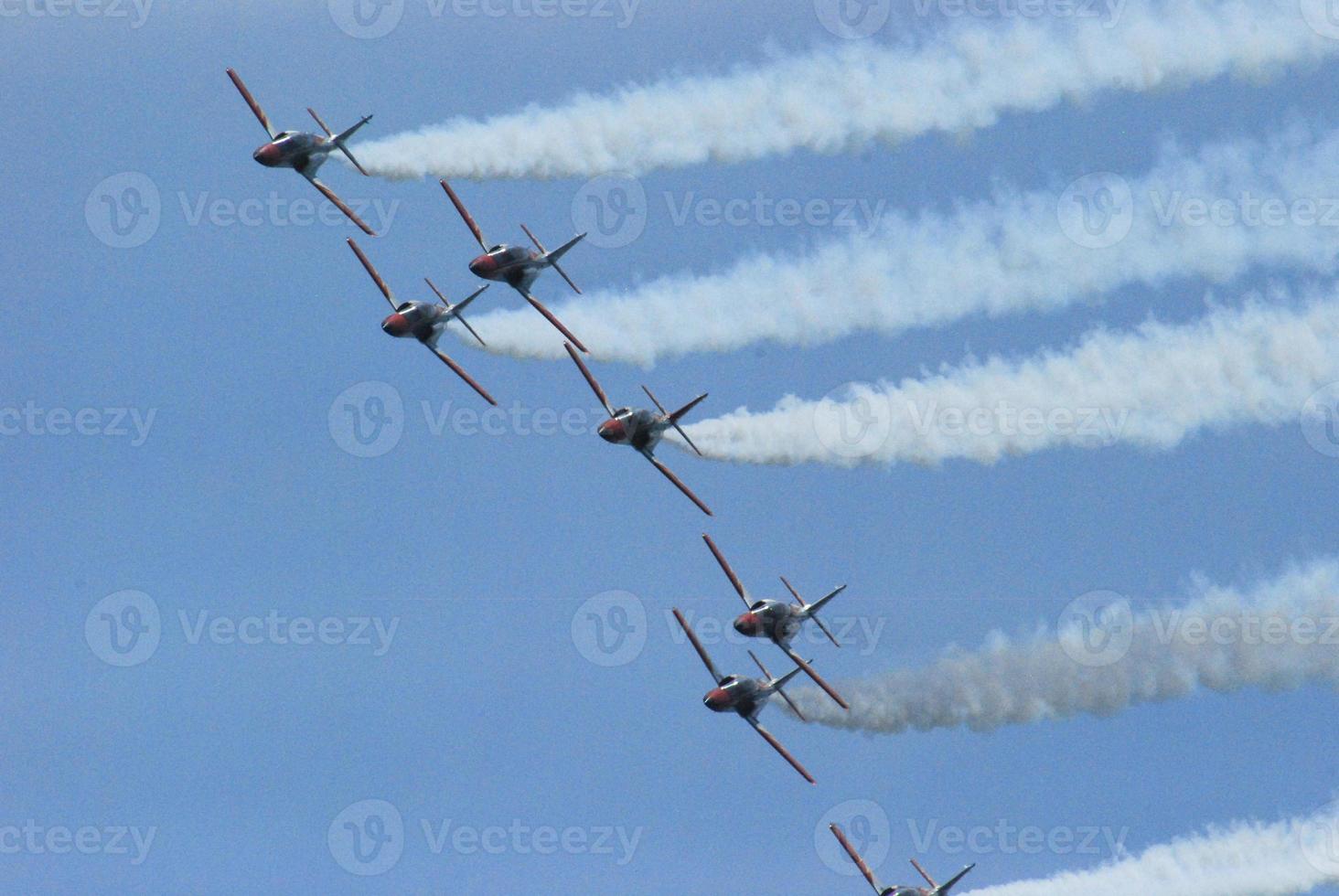 squadron of planes at an air show photo