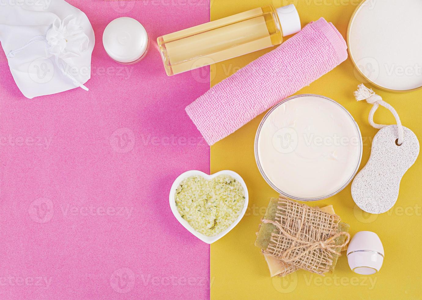 Set cosmetics SPA.  Mockup on pink-yellow background, place you design. Top view photo