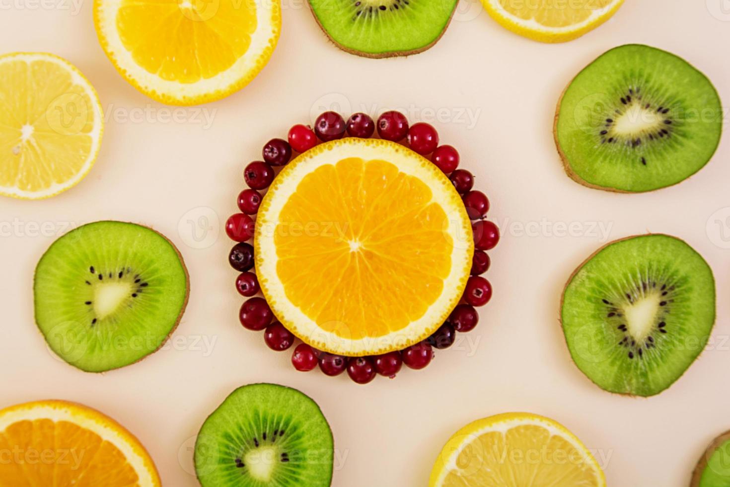 Fruit texture. Background of various sliced fruits photo