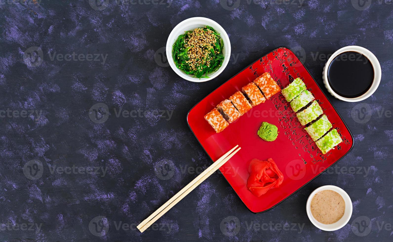 Sushi roll on dark background. Top view photo