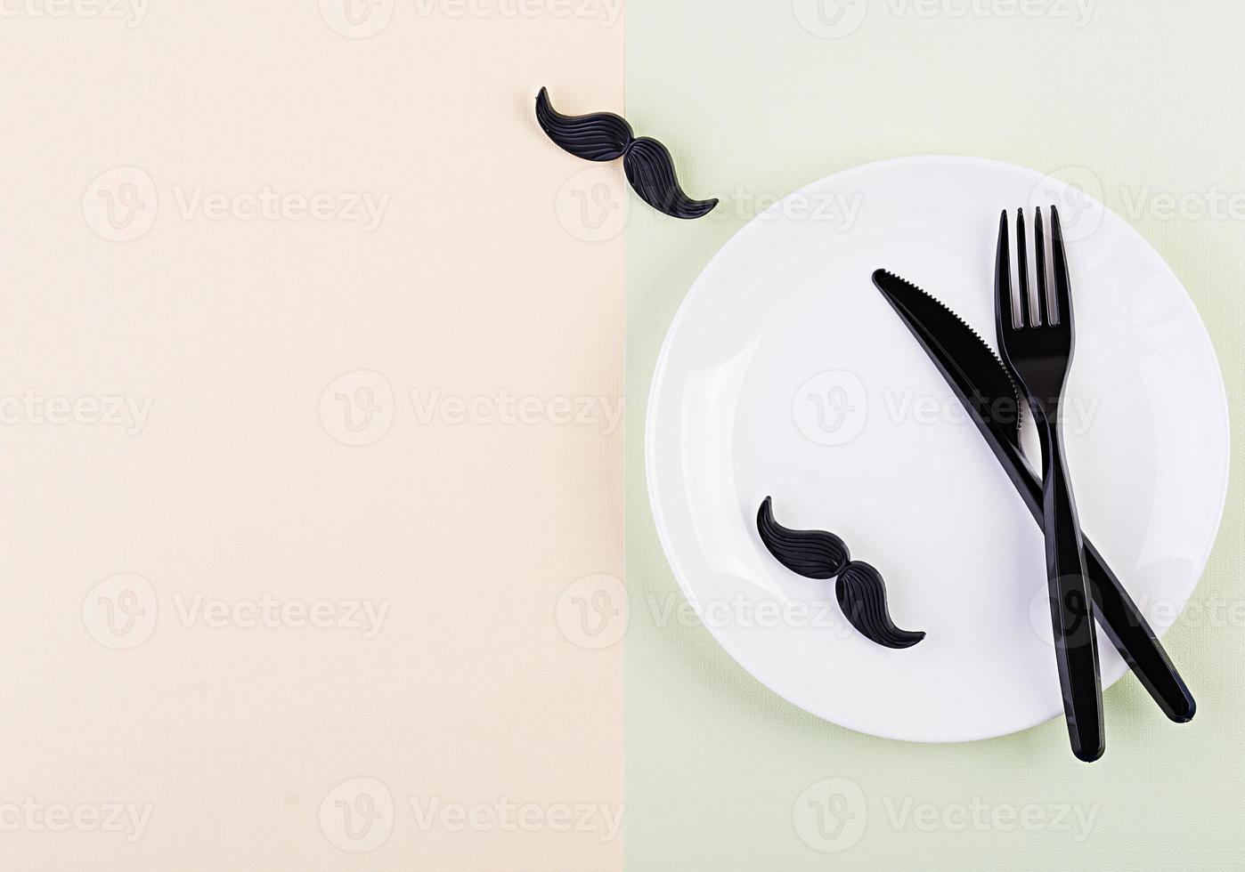 Table setting on Fathers day with cutlery and mustache . Happy Fathers day. Background of fathers day. photo