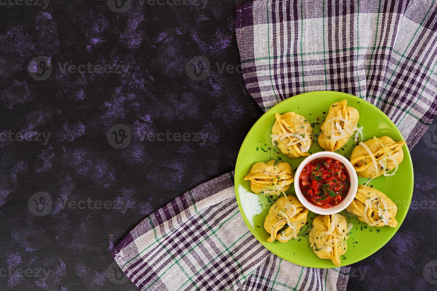 Delicious manti dumplings on dark background photo